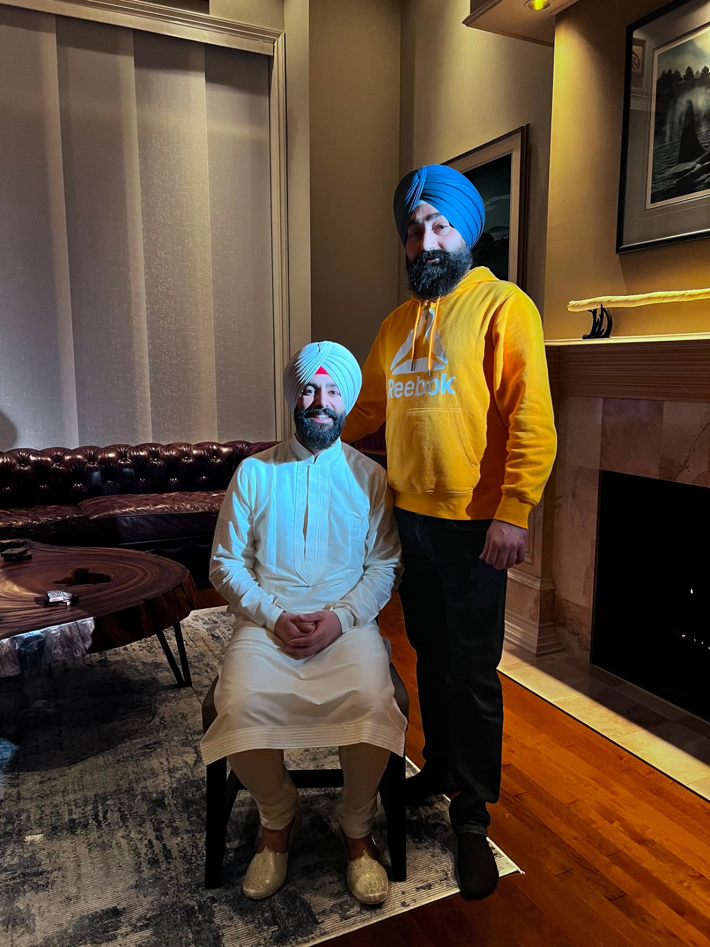 Groom in white kurta with custom blue turban
